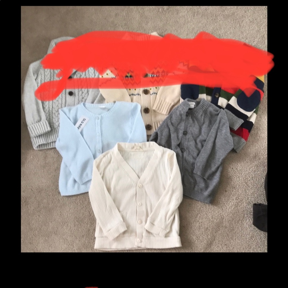 Three baby sweaters